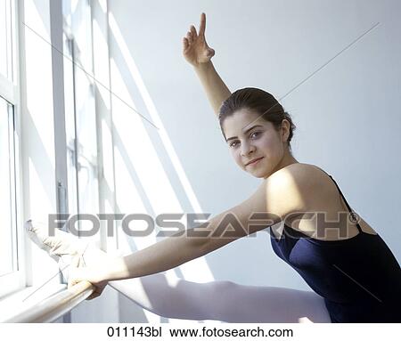 Young teenager posing at ballet barre by the window View Large Photo Image Stock Image - Young teenager posing at ballet barre by the window. Fotosearch