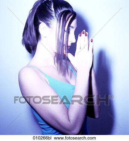 young woman in meditation position, hands folded View Large Photo Image Stock Image - young woman in meditation position, hands folded. Fotosearch