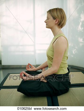 young woman meditating View Large Photo Image Stock Image - young woman meditating. Fotosearch