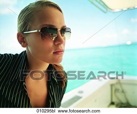 young woman model posing on yacht View Large Photo Image Stock Image - young woman model posing on yacht. Fotosearch