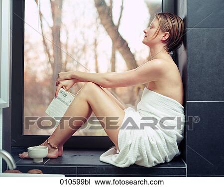 young woman with eyes closed sitting on window seat View Large Photo Image Stock Image - young woman with eyes closed sitting on window seat . Fotosearch