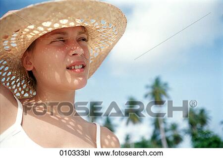 young woman with large summer straw hat View Large Photo Image Stock Image - young woman with large summer straw hat. Fotosearch