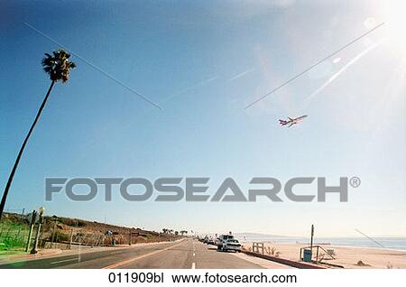 airplane taking off over empty road View Large Photo Image Stock Image - airplane taking off over empty road. Fotosearch