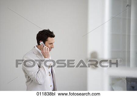 businessman talking on mobile phone View Large Photo Image Stock Image - businessman talking on mobile phone. Fotosearch
