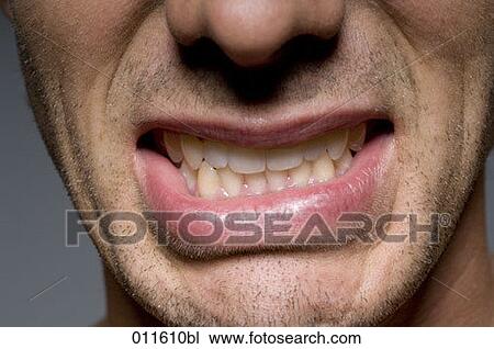 close up of man´s mouth with clenched teeth View Large Photo Image Stock Image - close up of man´s mouth with clenched teeth. Fotosearch