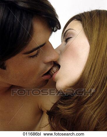 close-up of young couple biting in a piece of chocolate View Large Photo Image Stock Image - close-up of young couple biting in a piece of chocolate. Fotosearch
