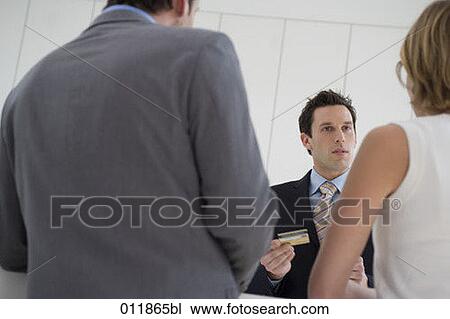 close-up of young couple paying with credit card at reception View Large Photo Image Stock Image - close-up of young couple paying with credit card at reception. Fotosearch