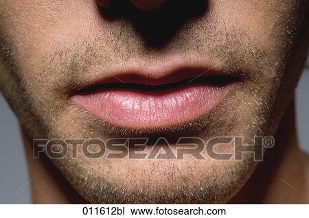Stock Image - close up of young man´s lips. Fotosearch