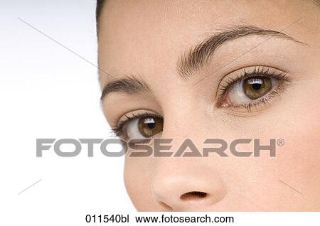 close-up of young woman looking into camera View Large Photo Image Stock Image - close-up of young woman looking into camera. Fotosearch