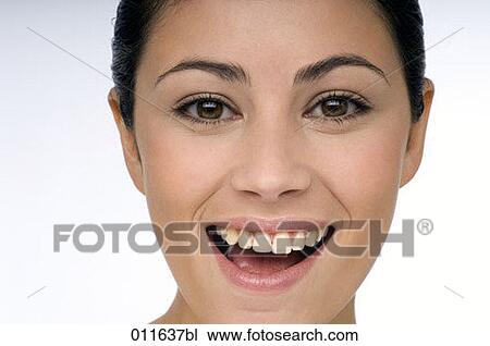 close-up of young woman with a naughty smile View Large Photo Image Stock Image - close-up of young woman with a naughty smile. Fotosearch