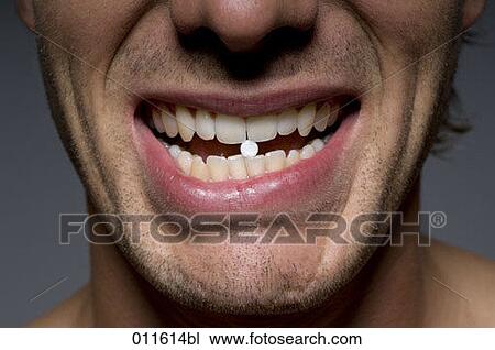 close-up on a man´s mouth with mint between his teeth View Large Photo Image Stock Image - close-up on a man´s mouth with mint between his teeth. Fotosearch