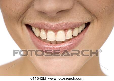 close-up on a young woman smiling View Large Photo Image Stock Image - close-up on a young woman smiling. Fotosearch