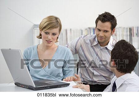 Stock Image - group of office workers in discussion. Fotosearch