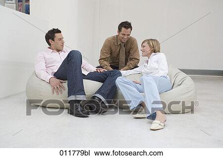 group of three friends talking View Large Photo Image Stock Image - group of three friends talking. Fotosearch