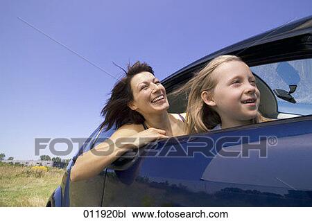 happy mother and daughter sitting in car together View Large Photo Image Stock Image - happy mother and daughter sitting in car together. Fotosearch
