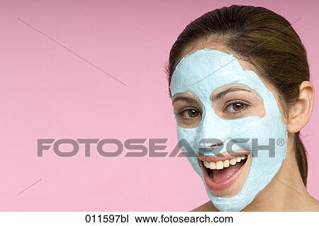 laughing young woman with face mask View Large Photo Image Stock Image - laughing young woman with face mask. Fotosearch