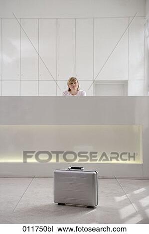 lonely briefcase standing in front of reception View Large Photo Image Stock Image - lonely briefcase standing in front of reception. Fotosearch