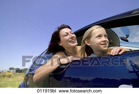mother and daughter looking out of car window View Large Photo Image Stock Image - mother and daughter looking out of car window. Fotosearch