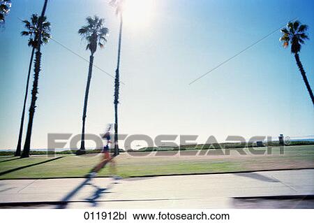 person jogging along boulvard View Large Photo Image Stock Image - person jogging along boulvard. Fotosearch