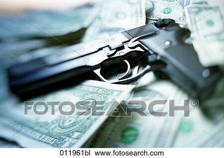 pistol lying on dollar notes View Large Photo Image Stock Image - pistol lying on dollar notes. Fotosearch
