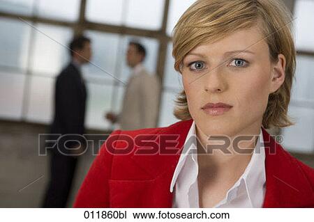 Stock Image - portrait of businesswoman in red jacket. Fotosearch