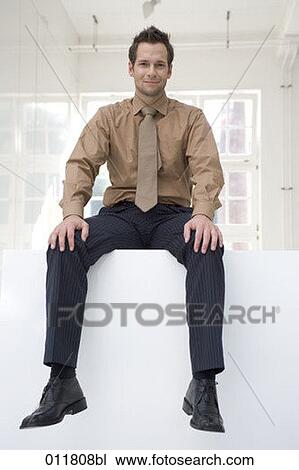 Stock Image - portrait of young businessman in shirt and tie. Fotosearch