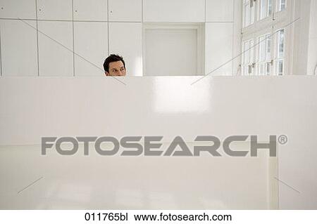 Stock Image - receptionist looking out of the window. Fotosearch