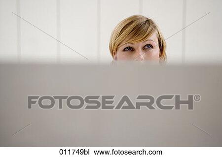 receptionist looking up behind her desk View Large Photo Image Stock Image - receptionist looking up behind her desk. Fotosearch