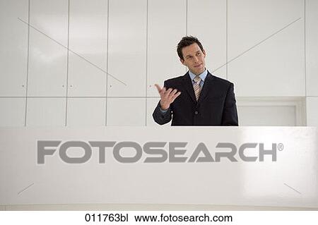 receptionist making a gesture View Large Photo Image Stock Image - receptionist making a gesture. Fotosearch