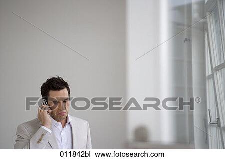 sad looking businessman with cellphone View Large Photo Image Stock Image - sad looking businessman with cellphone. Fotosearch