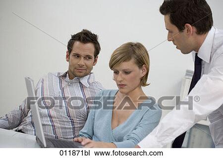 serious looking woman being helped by colleagues View Large Photo Image Stock Image - serious looking woman being helped by colleagues. Fotosearch
