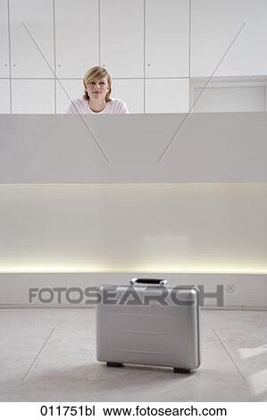 silver briefcase standing in front of reception View Large Photo Image Stock Image - silver briefcase standing in front of reception. Fotosearch