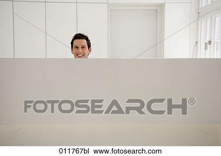 smiling receptionist behind his desk View Large Photo Image Stock Image - smiling receptionist behind his desk. Fotosearch