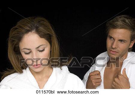 young couple in bathrobes looking unhappy View Large Photo Image Stock Image - young couple in bathrobes looking unhappy. Fotosearch