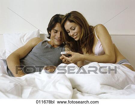 young couple looking at display of digital camera View Large Photo Image Stock Image - young couple looking at display of digital camera. Fotosearch