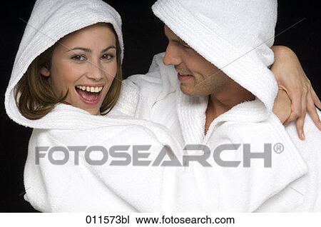 young couple playing around in bathrobes View Large Photo Image Stock Image - young couple playing around in bathrobes. Fotosearch