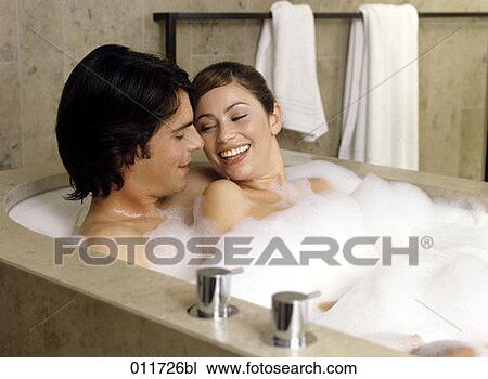 young couple smiling at each other in bath View Large Photo Image Stock Image - young couple smiling at each other in bath. Fotosearch
