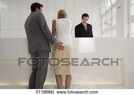 young couple standing at reception man touching woman´s buttocks View Large Photo Image Stock Image - young couple standing at reception man touching woman´s buttocks. Fotosearch