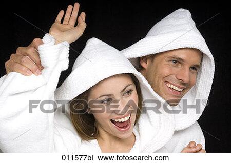 young couple waerin bathrobes having fun together View Large Photo Image Stock Image - young couple waerin bathrobes having fun together. Fotosearch