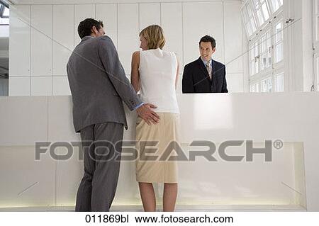 young couple waiting at reception man touching woman´s behind View Large Photo Image Stock Image - young couple waiting at reception man touching woman´s behind. Fotosearch