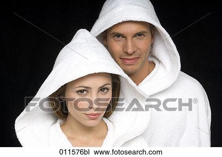 young couple wearing bathrobes looking into camera View Large Photo Image Stock Image - young couple wearing bathrobes looking into camera. Fotosearch