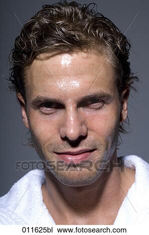 Stock Image - young man after taking a shower. Fotosearch