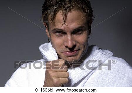 young man in bathrobe looking into camera View Large Photo Image Stock Image - young man in bathrobe looking into camera. Fotosearch