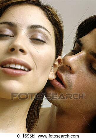 young man nibbling on his girlfriend´s earlobe View Large Photo Image Stock Image - young man nibbling on his girlfriend´s earlobe. Fotosearch
