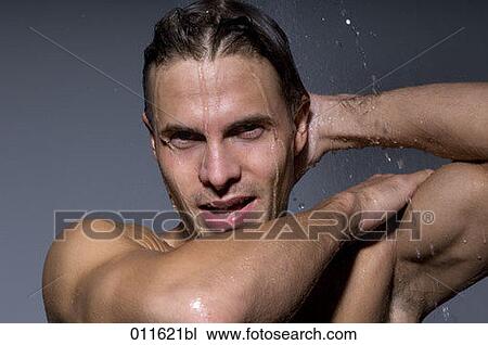 Stock Image - young man taking a shower. Fotosearch