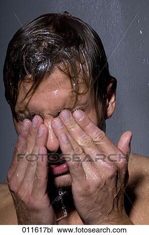 young man washing his eyes under a shower View Large Photo Image Stock Image - young man washing his eyes under a shower. Fotosearch