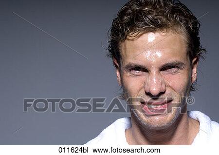 young man wearing bathrobe after taking a shower making funny faces View Large Photo Image Stock Image - young man wearing bathrobe after taking a shower making funny faces. Fotosearch