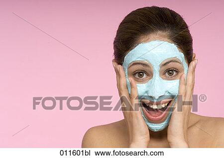 young woman laughing with face mask View Large Photo Image Stock Image - young woman laughing with face mask. Fotosearch