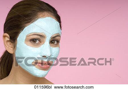 young woman wearing beauty face mask View Large Photo Image Stock Image - young woman wearing beauty face mask. Fotosearch