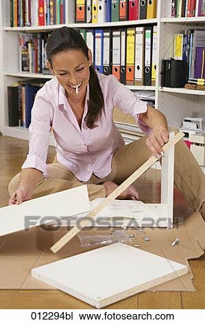 assembling, caucasian, casual, artificial light View Large Photo Image Stock Image - assembling, caucasian, casual, artificial light. Fotosearch
